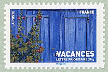 Image du timbre Porte bleue et roses trémières